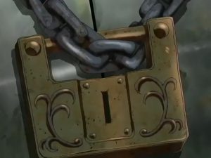 간소한 문양이 새겨진 먼지 쌓인 금 자물쇠